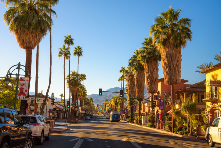 Palm Springs, California, USA - December 27, 2017 : Scenic street view of Palm Springs at sunrise. It is a desert resort city in Riverside County within the Coachella Valley.