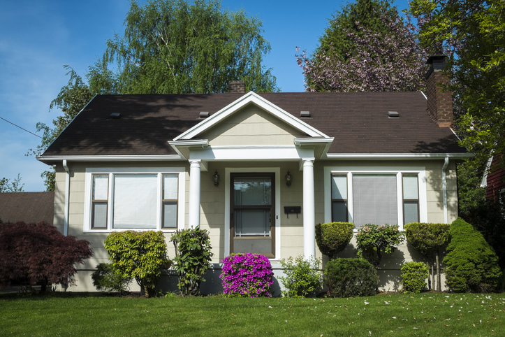 Single-family American craftsman house with blue sky background